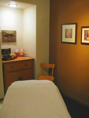 All of our treatment rooms are soothing, beautiful, and furnished with custom cabinetry from Madera!