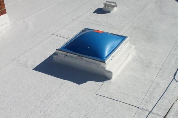 Skylight installed on a Silicone Coated flat roof.