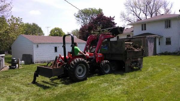 Removing pea gravel to seed area for a lawn