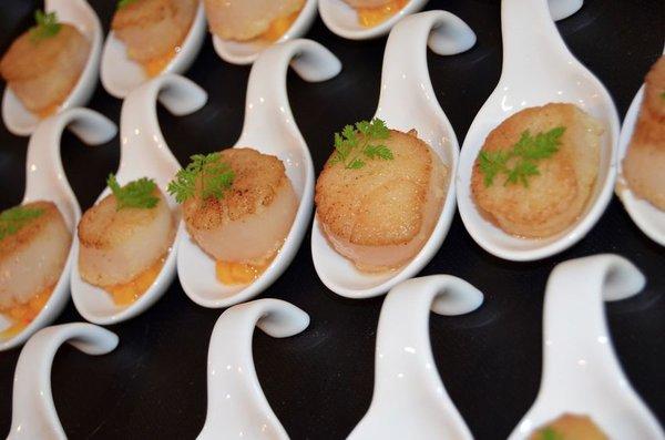 Saffron Scallops in spoons.