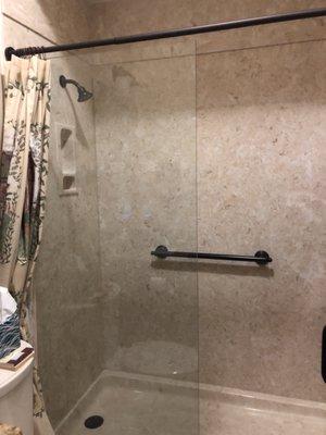 Marble shower with sturdy bar for our senior guests. Non slick flooring.