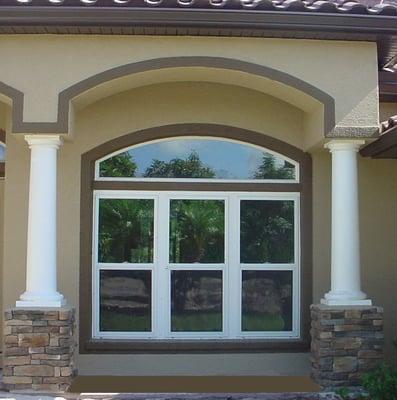 Vinyl double hung windows with an arch accent