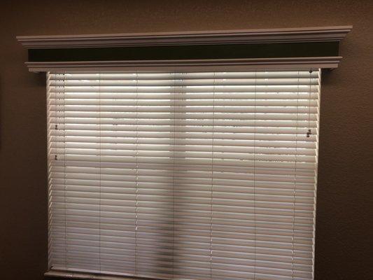 Custom built wood cornice and 2 inch blinds