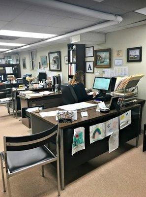 Allison Gagliardi, President of Troy Insurance, at desk.