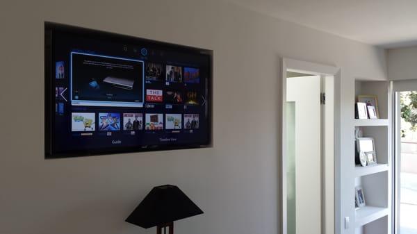 Smart TV recessed into a wall cutout