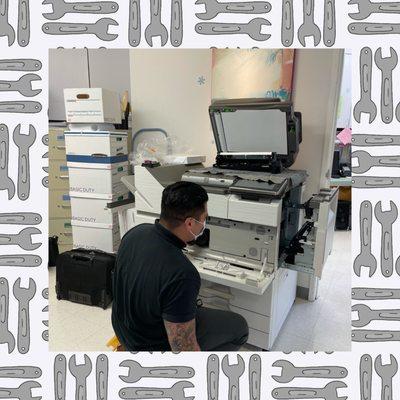 Michael Meza Tech fixing the Copy Machine  Thank you  thank you  thank you a million !!