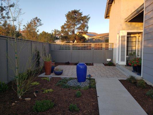 Everything in this picture done by Breceda Landscape (fence, gate, concrete, pavers, lighting, plants)