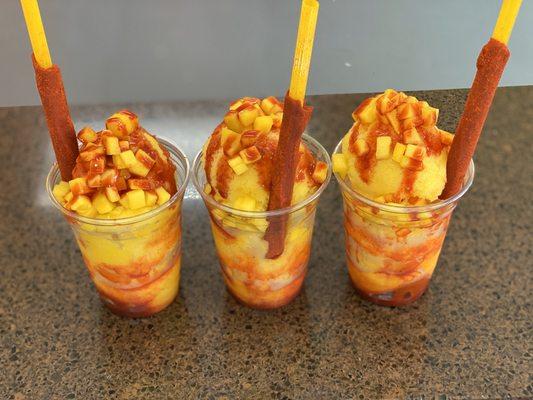 Mangoneada  handmade  ice cream with chopped mango  and sour sauce (chamoy)