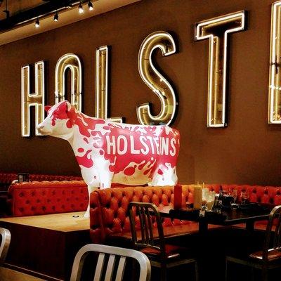 Cushy leather benches and kitschy decor evoke an old school diner feel at Holsteins