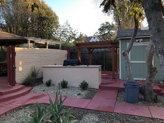 Poured concrete walkway and BBQ area