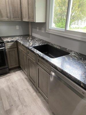 Black Quartz single bowl under mount sink with bevel edge color Magnata.