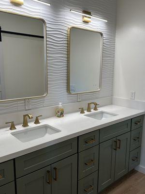 Olive Green Shaker vanity cabinets with gold hardware. Gorgeous bathroom look!