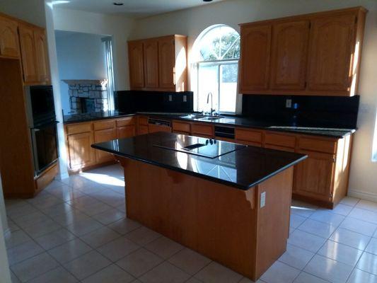 This is the kitchen.I also cleaned the floor and grout.I also cleaned and put a clear coat on the wood in the kitchen and stair railing.