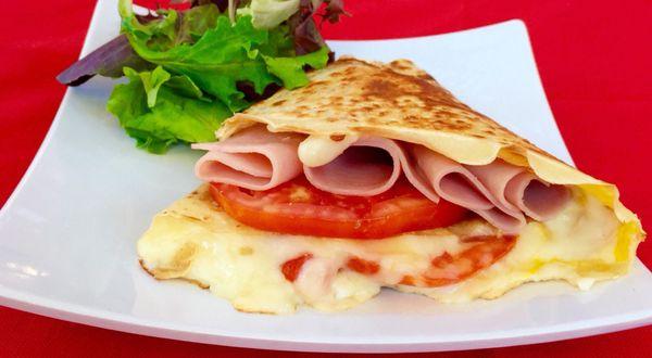 savory crepe with eggs, ham , tomato & cheese