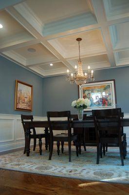 Dining room with coffered ceiling and trim details in a new home built by Debcan Construction.