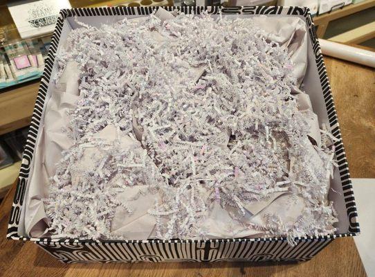 This is what the package looked like inside, showing the shredded paper and filling I had to buy separately.