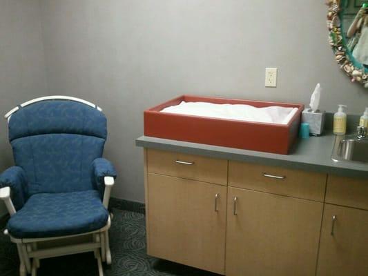 Diaper changing and nursing room.