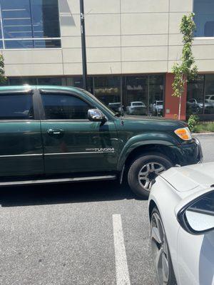 Again, her car blocking mine in and as you can see the FREE parking spot next to mine.