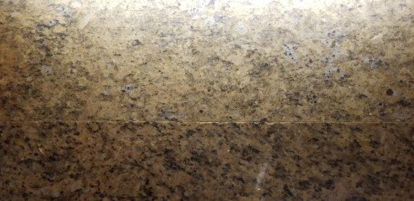 Mismatched granite with visible gunk in the seam