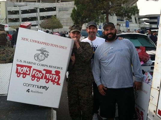 Assisting with Toys for Tots and Chargers toy drive