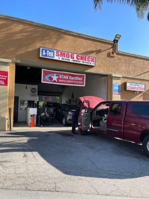 The front of the business inside a strip mall