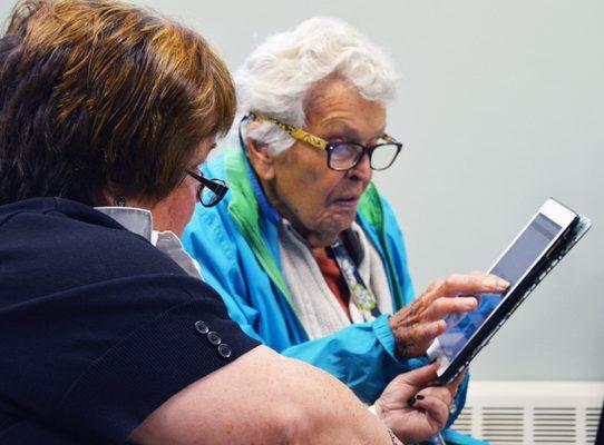 Dr. Antonellis demonstrates for a client, some of the latest hearing health technology.