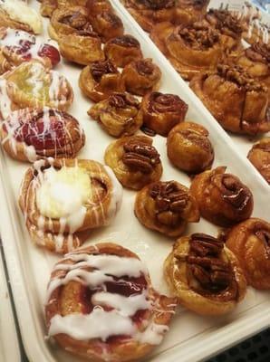 An assortment of pastries.. Cheese/ cherry danishes & sticky buns shown here.