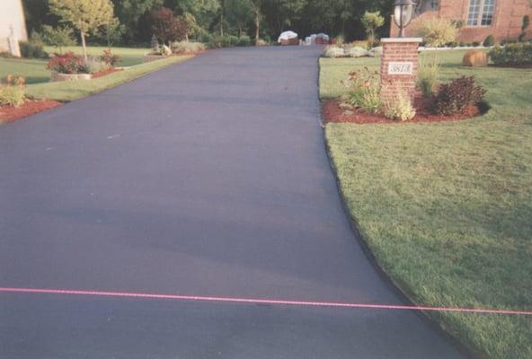 House driveway, slurry seal coat, preserve and protect for many years.