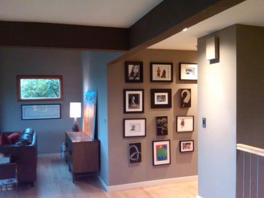 Drywall work and painting that is shown off by the homeowner's wall decorations!