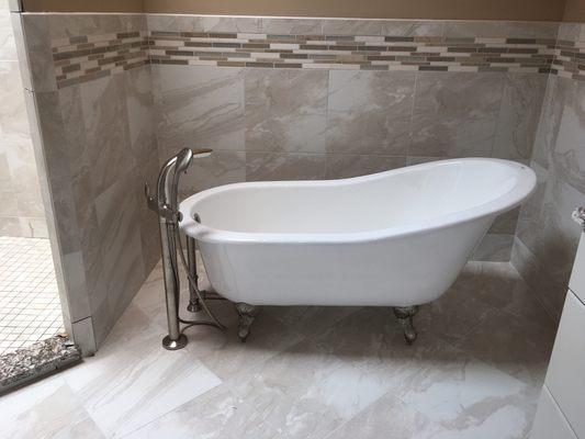 Here's a new slipper tub and floor mounted faucet we just put in this remodeled master bathroom.