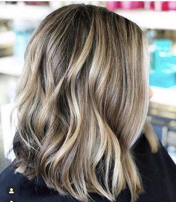 Highlights and lows to create a more dimensional color .
Haircut Textured Lob