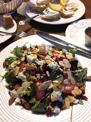 Strawberry salad with pecans, blue cheese , and almonds