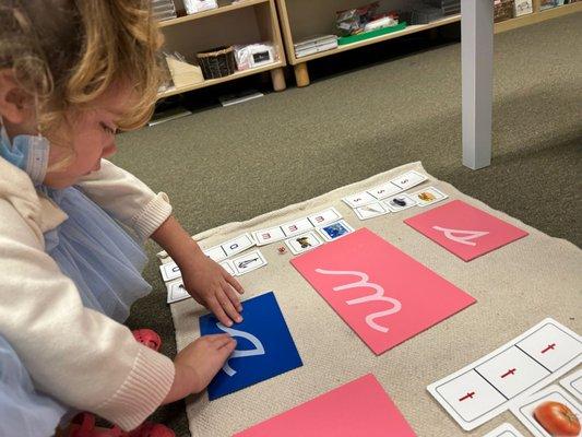 Introduction to the cursive sandpaper letters.