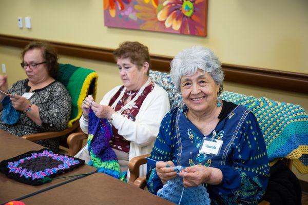 Seniors at St. Paul's PACE have a knitting club where they make blankets and such to donate.