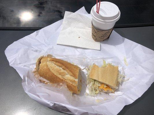 Avocado and turkey cheddar cheese sandwich on sourdough. With a mocha coffee.