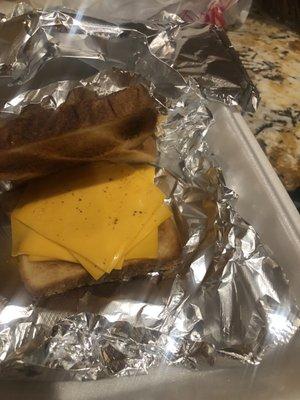 Raw cheese inside of toasted bread