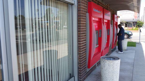 Three ATM's outside the bank.