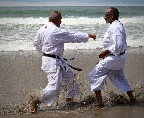 Hanshi Rick Llewelyn, President of ISKA, trains with Hanshi Robert Stevenson, ISKA Technical Director, at Stinson Beach.