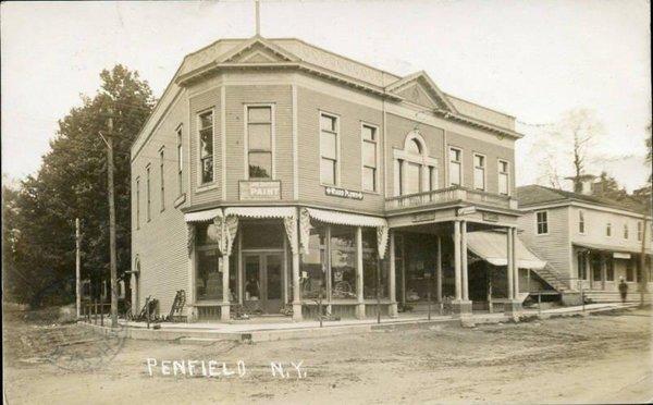 This is what the building looked like when it was first built, notice the balcony. It was removed in 1970 so they could widen Penfield Rd.