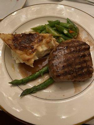 Filet with scalloped potato.