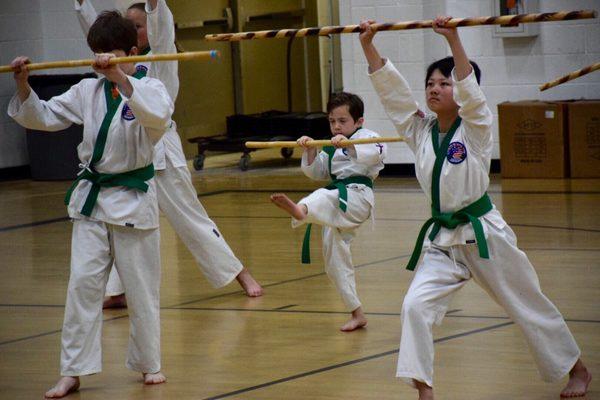 Green belts using their weapons