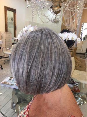 Silver highlights on dark base. Even cut and styled