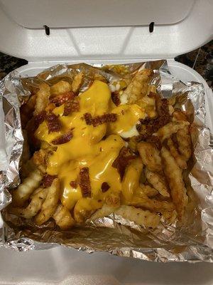 Beast fries, add bacon. They look much better than they tasted. That's a solid mass of processed cheese on top.