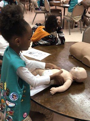 Girl Scout of Atlanta troop members learning the importance of CPR and First Aid.