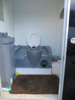 Private bathroom with sink & heat  - perfect for avoiding long lines during tailgating parties.