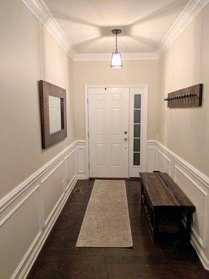 Installed the crown molding, wainscoting and painted