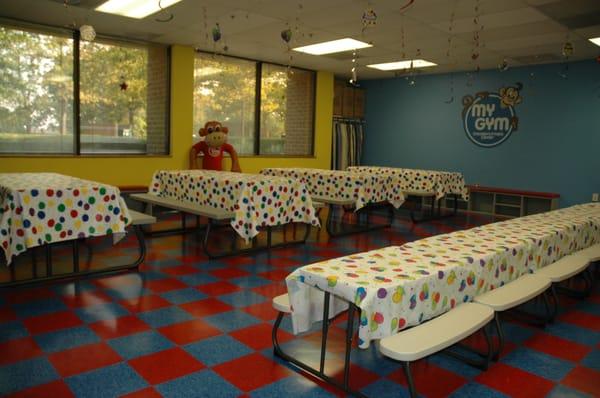 Party room with adult and child size tables.  Lots of room.