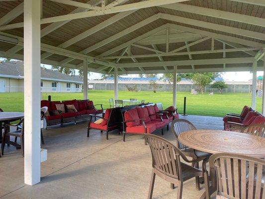 The pavilion in the grassy area, comfy couches & clean tables