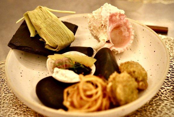 Three sisters and sea - tamale with corn, beans, squash, crab cakes and prawn tempura (prawn is wrapped in the curly fried yumminess