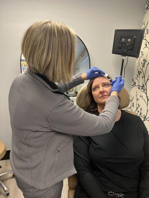 A guest receiving an anti-aging treatment